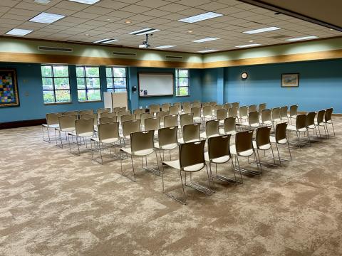 Meeting room with chairs facing a lectern.