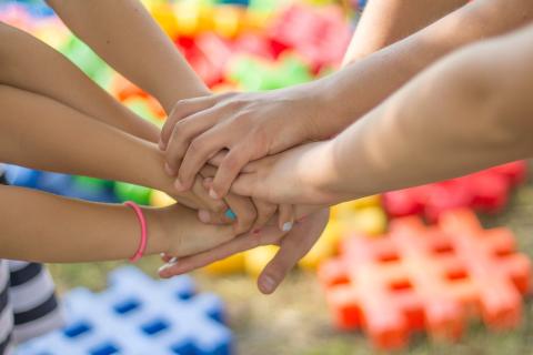 Children touching hands