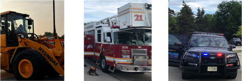 Three city vehicles including a front loader, fire engine, and a police cruiser