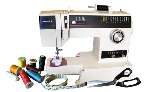 A sewing machine, scissors, and notions