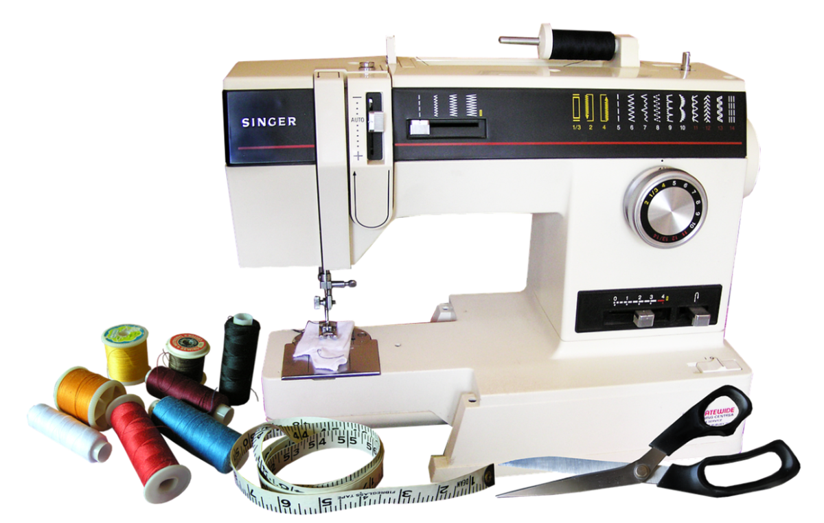 A sewing machine, scissors, and notions