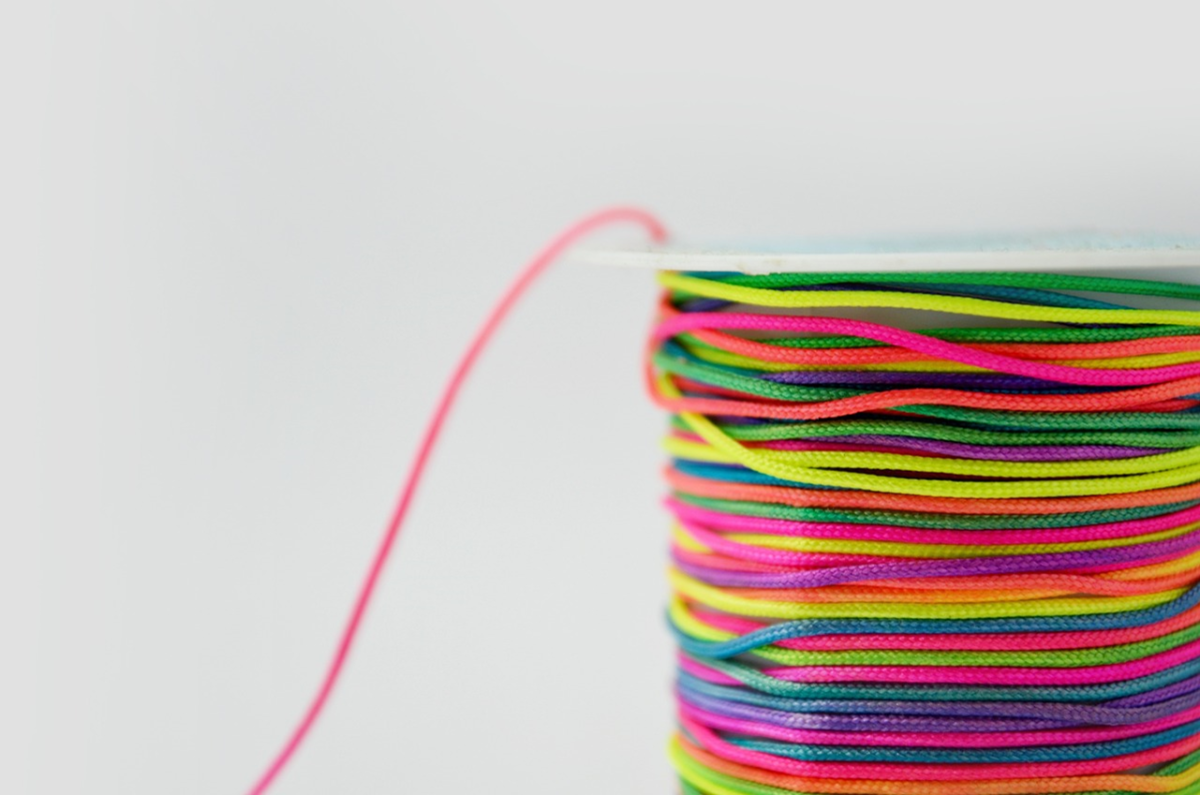 Spool of string with multiple colors